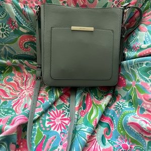 NWOT Nine West Purse in a beautiful gray/teal color. Adjustable cross-body.